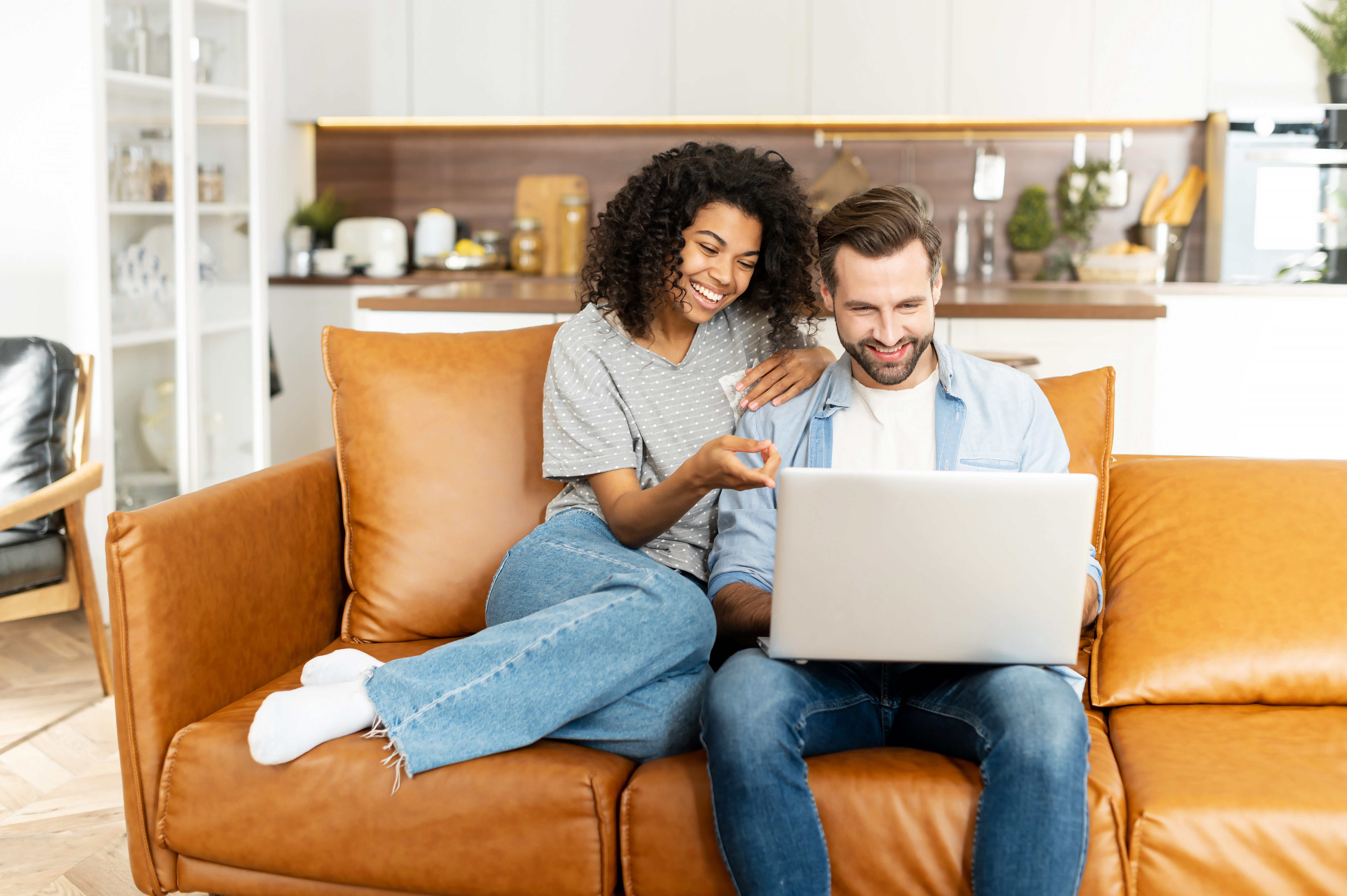couple on computer attending online baby class at home virtual
