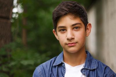 young teen boy facing camera